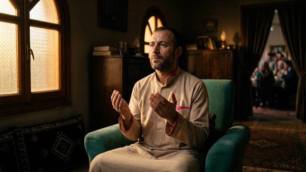 A Muslim man in a quiet room away from a difficult family conversation, an opening scene for the Dua During Family Disputes.