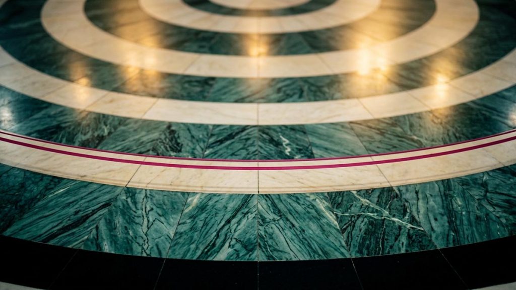A still-life of the polished marble floor of the circuit path around the courtyard, illustrating the Dua During Tawaf.