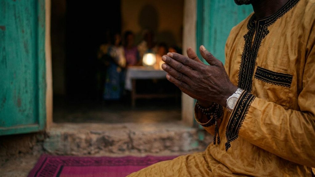 Close view of a Muslim man's hands and the doorway during the Dua for Protection from Harm.