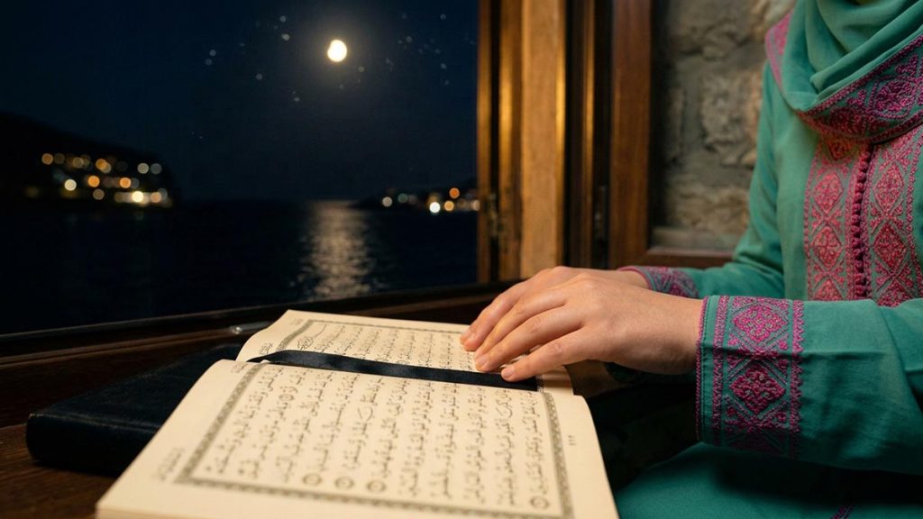 Close view of a Muslim woman's hands and the open Quran during the Dua of Prophet Yunus.