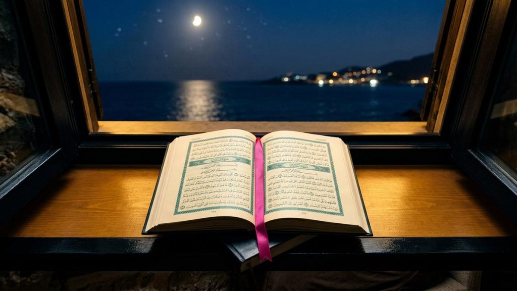 A still-life of an open Quran on a sill above a moonlit sea at night, illustrating the Dua of Prophet Yunus.