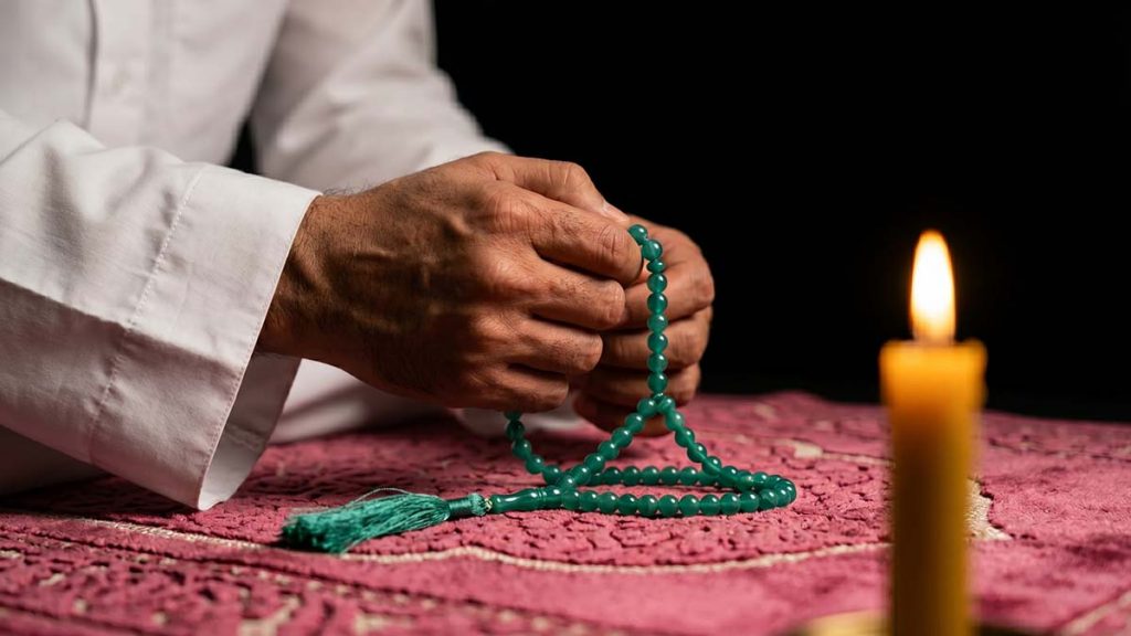 Muslim hands in dhikr on the first night of the Islamic New Year
