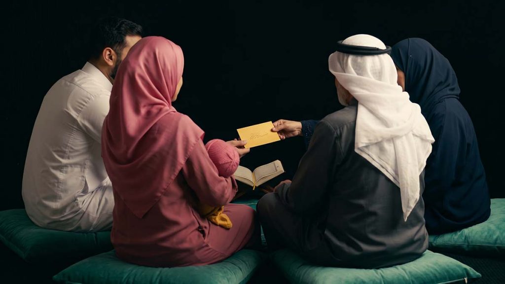 Muslim family celebrating the announcement at Naming a Baby in Islam gathering