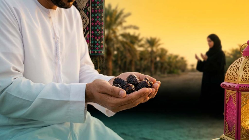 A Muslim pilgrim holding Ajwa Dates before a Madinah palm grove