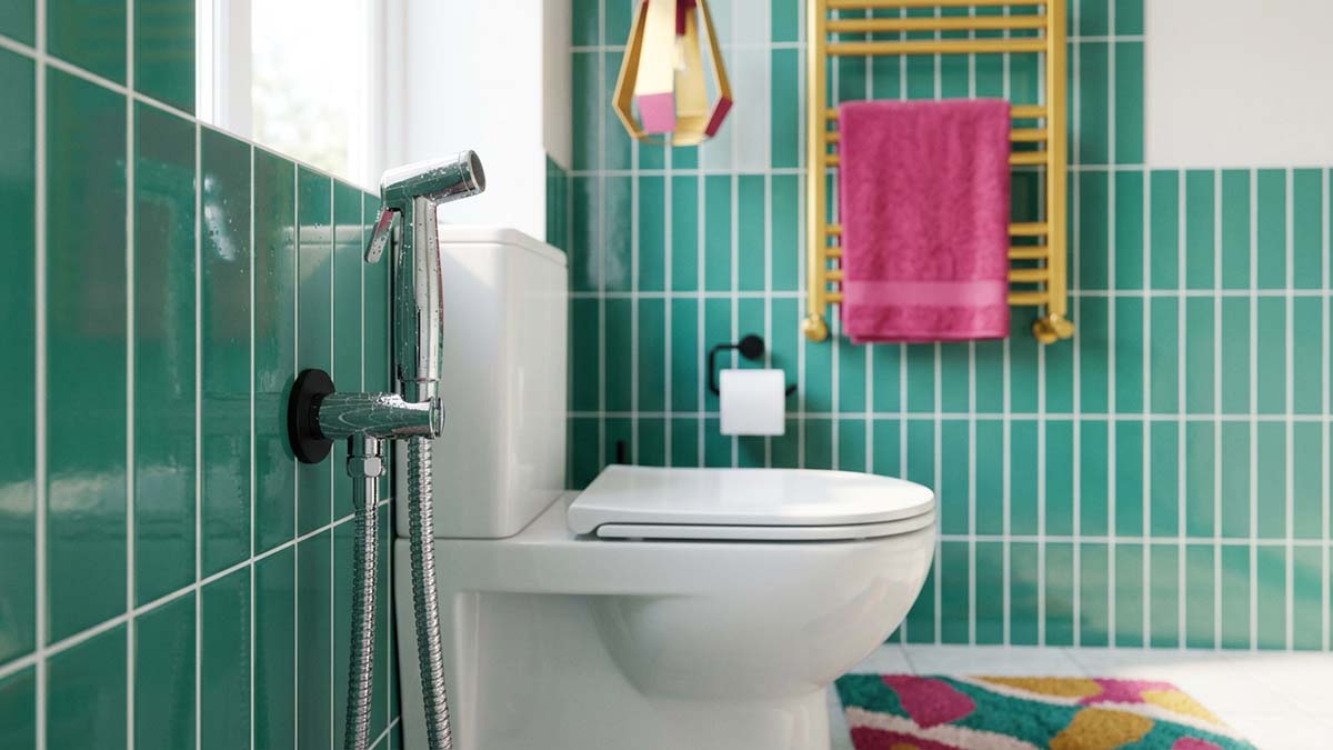 A handheld bidet shower in a teal-tiled bathroom, a Muslim Shower for purity